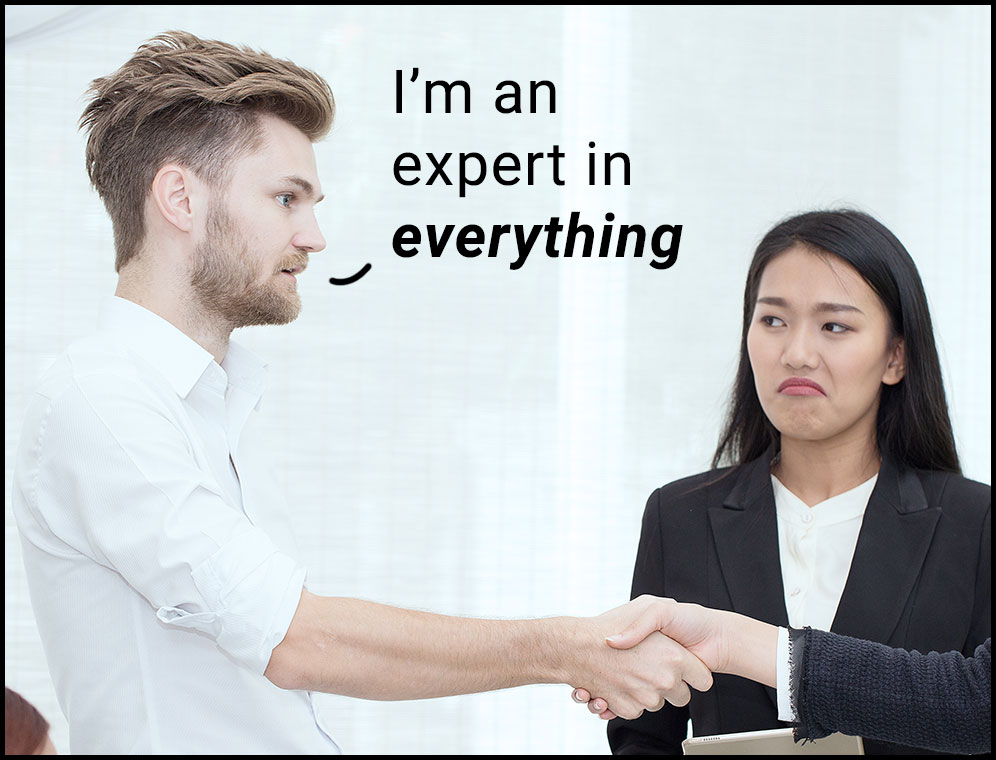 photo of young guy shaking hands on interview saying "Im an expert in everything"