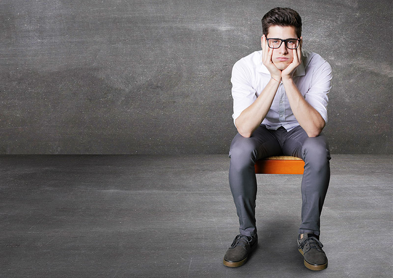 bored job candidate at interview sitting on a chair