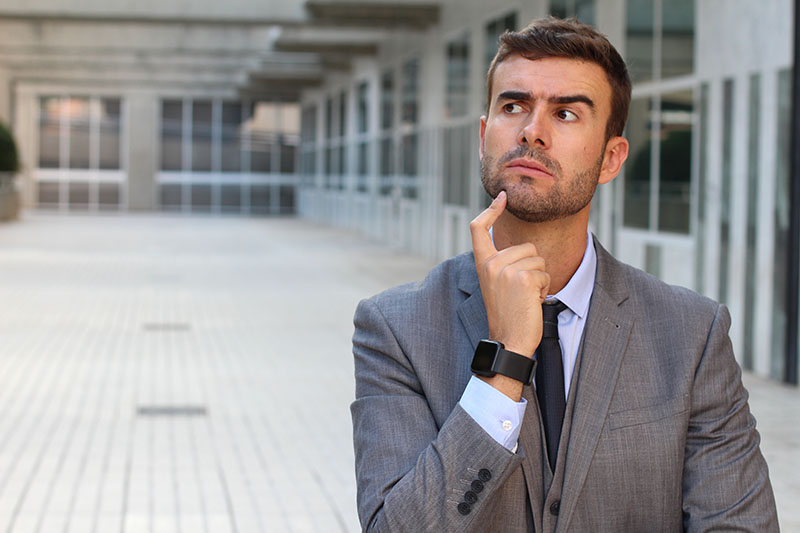 business applicant looking pensive trying to remember something
